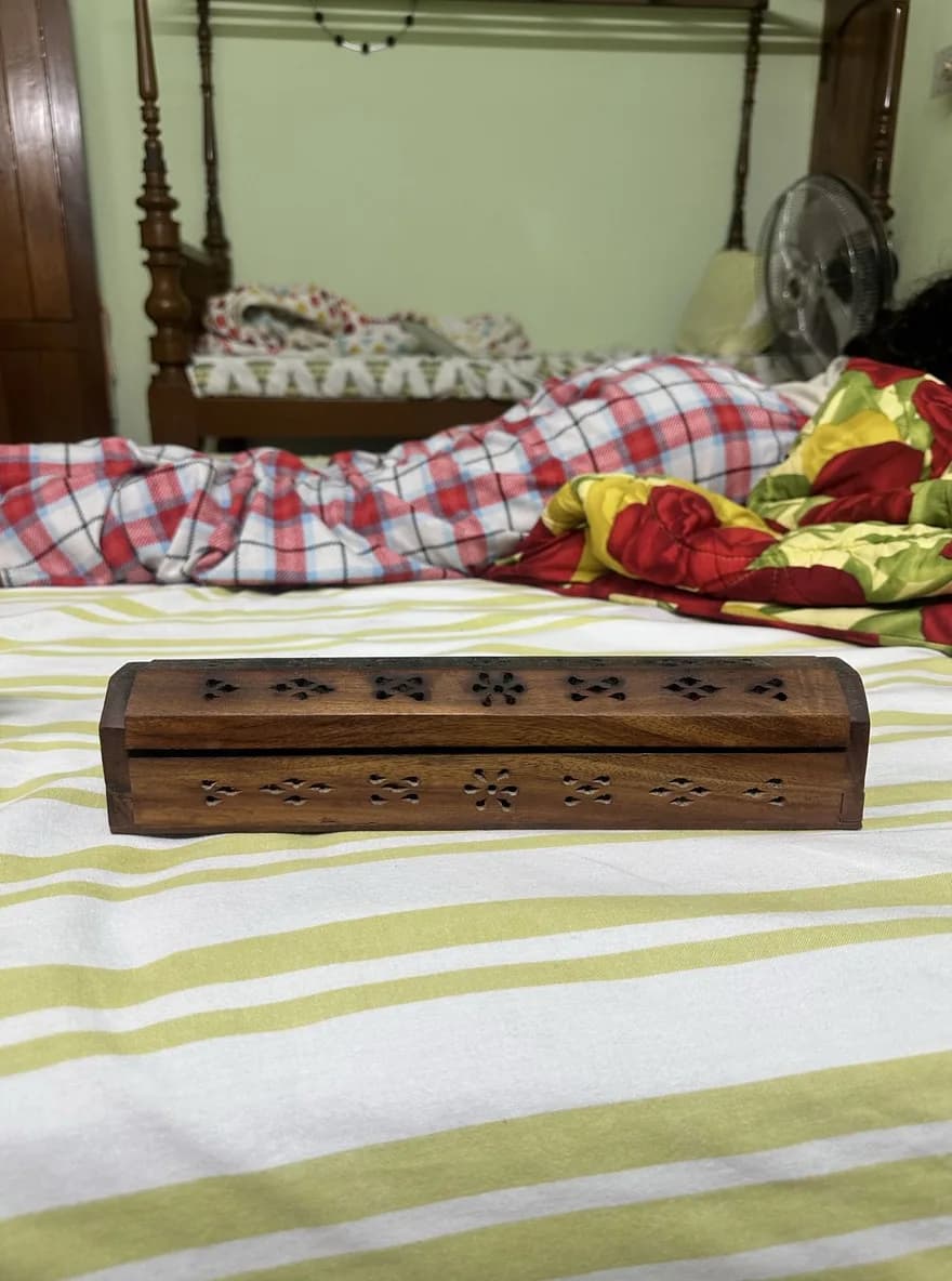 The original phone photo of the carved incense box